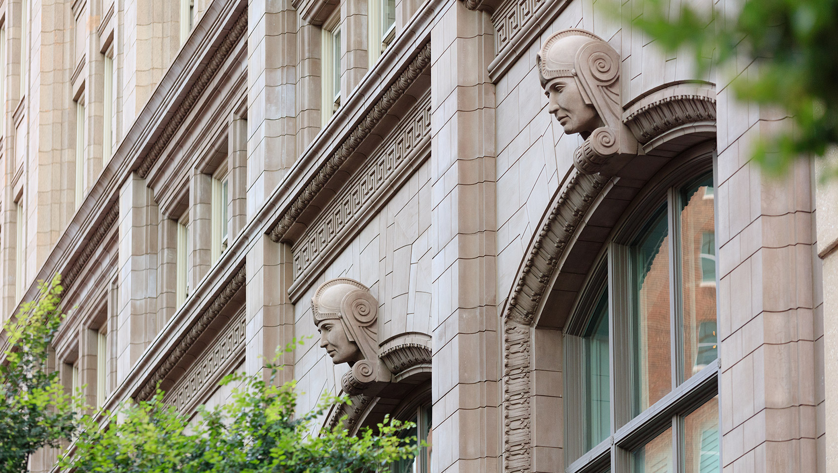 Exterior of the Harper Hotel with centurion statue facade