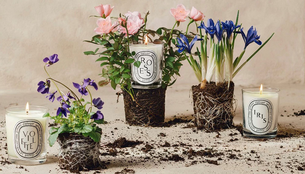 Flowers and candles set up for Diptyque event at The Harper Hotel Fort Worth